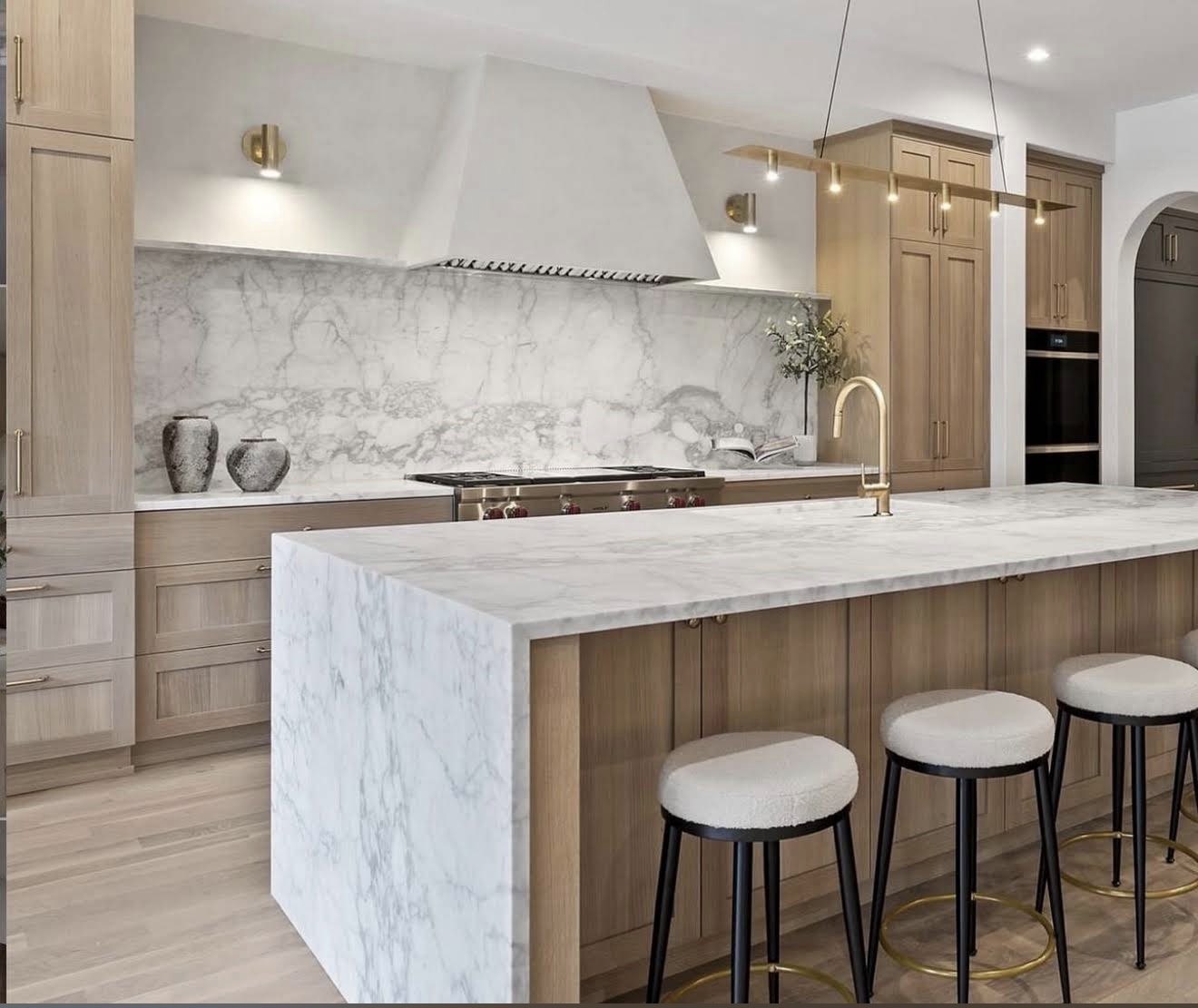 Marble waterfall island and brass fixtures, kitchen remodel, Newport Beach, CA