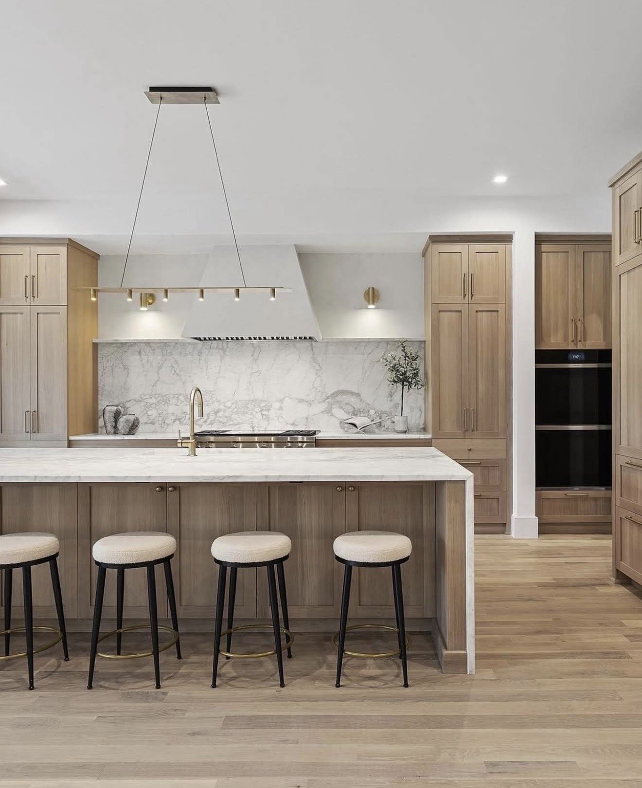 Kitchen remodel with white oak cabinetry, marble backsplash and island, Newport Beach, CA